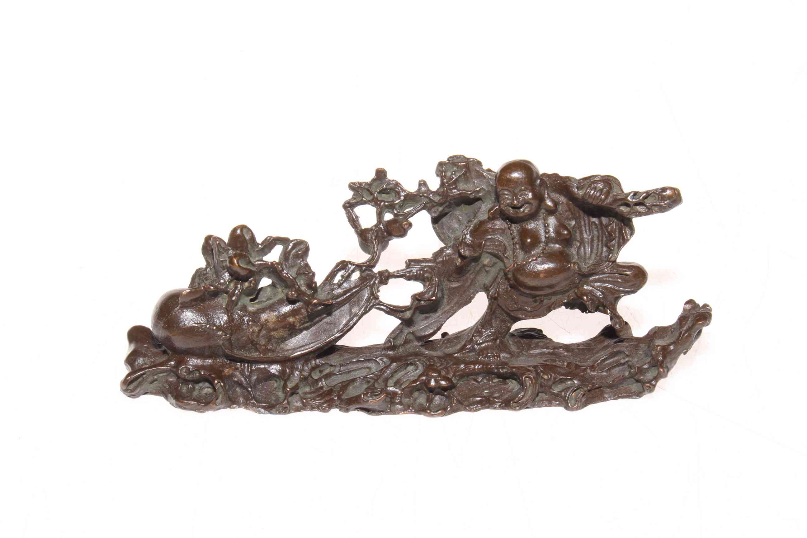 Chinese bronze of Buddha pulling along a gourd, 13cm length.