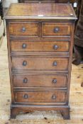 Mahogany, burr wood and line inlaid slim chest of two short above four long drawers,