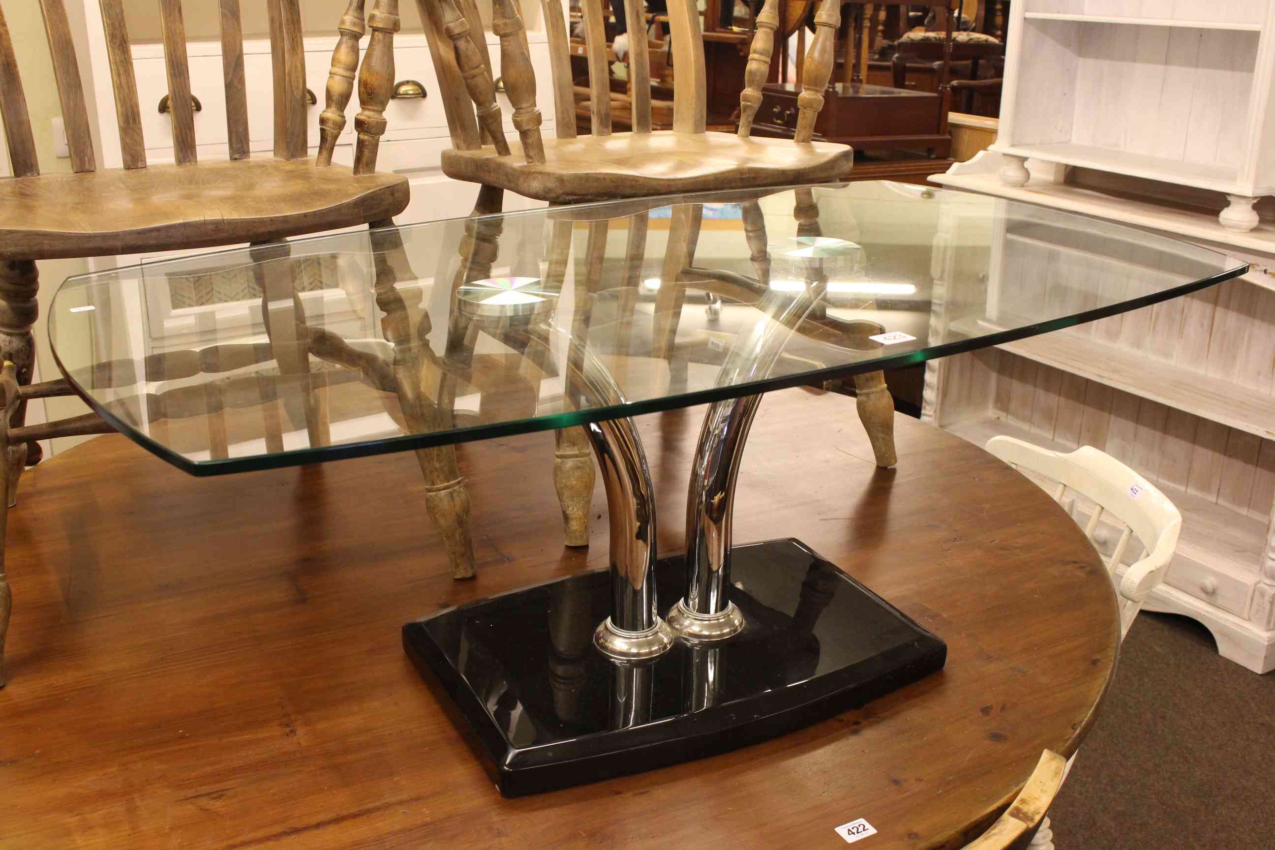 Contemporary rectangular glass topped coffee table, 43cm high by 110cm long by 65cm wide.