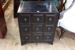 Black lacquered Chinese chest of nine partitioned drawers, 70cm high by 60cm wide by 45cm deep.