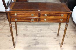 Reproduction mahogany and satinwood inlaid four drawer console table having rounded corners and