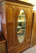 Edwardian inland mahogany oval mirror door wardrobe and dressing table.