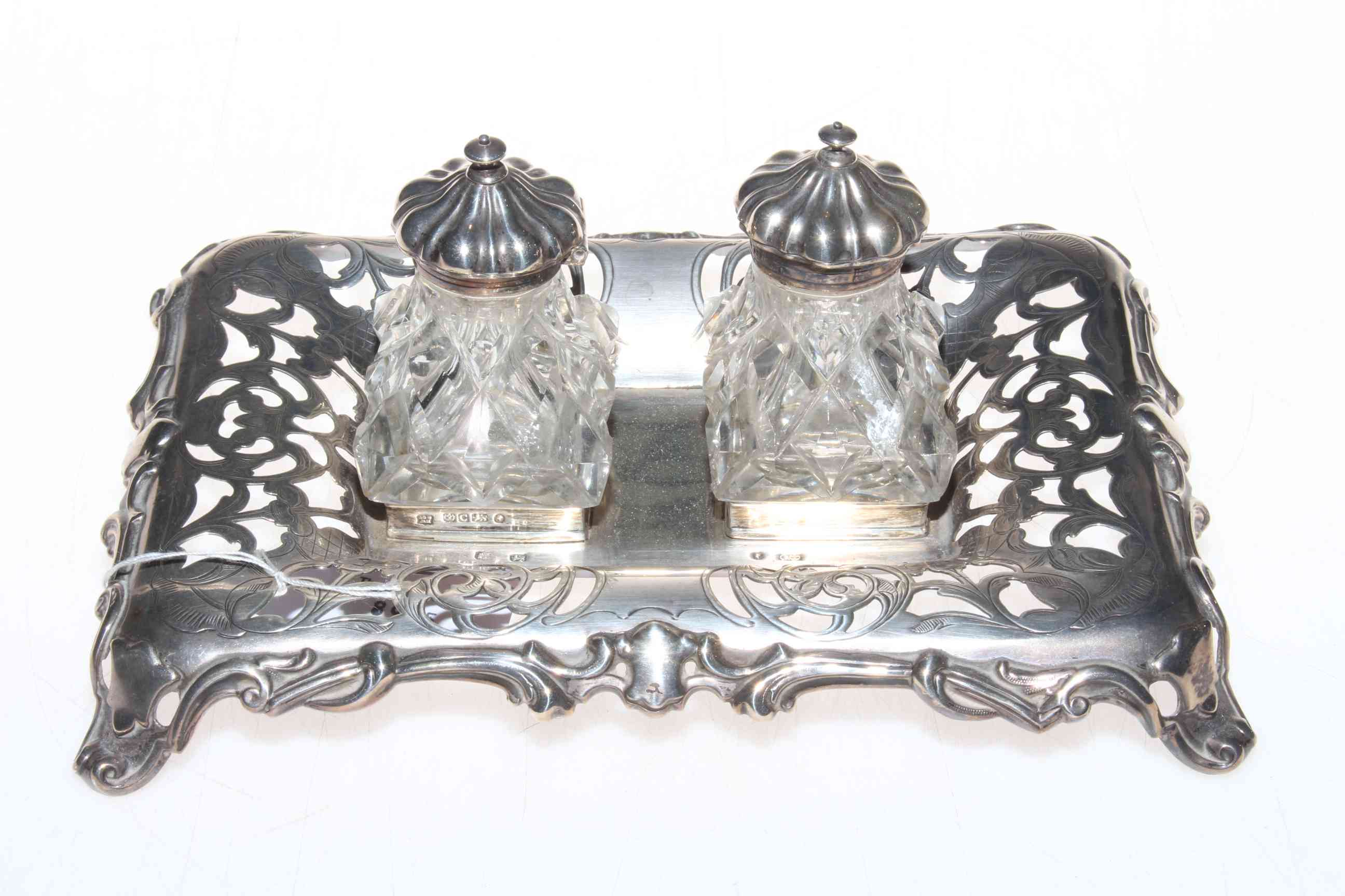 Victorian silver inkstand having pierced decoration and scroll border, 19.