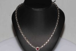 18 carat white gold, ruby and diamond necklace, 40cm length.