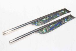 Unmarked silver and enamel pens for Major and Lady Baldrey, 16.5cm length.