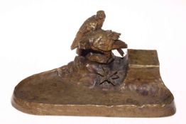 Late 19th Century cast bronze inkstand with eagles on naturalistic base, 28cm across.