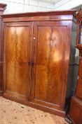 Victorian mahogany two door wardrobe, the right hand fitted with five sliding trays,