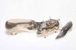 Silver pig pin cushion, Birmingham 1904, 5cm length, together with two silver shoe pin cushions (3).