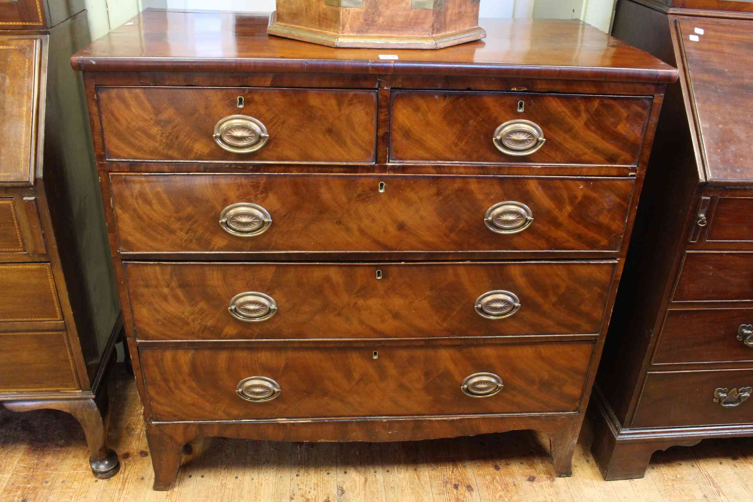 19th Century mahogany chest of two short above three long drawers on splayed legs,