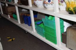 Large shelf collection of hand tools including two sewing machines, lawn spreader, leather case,