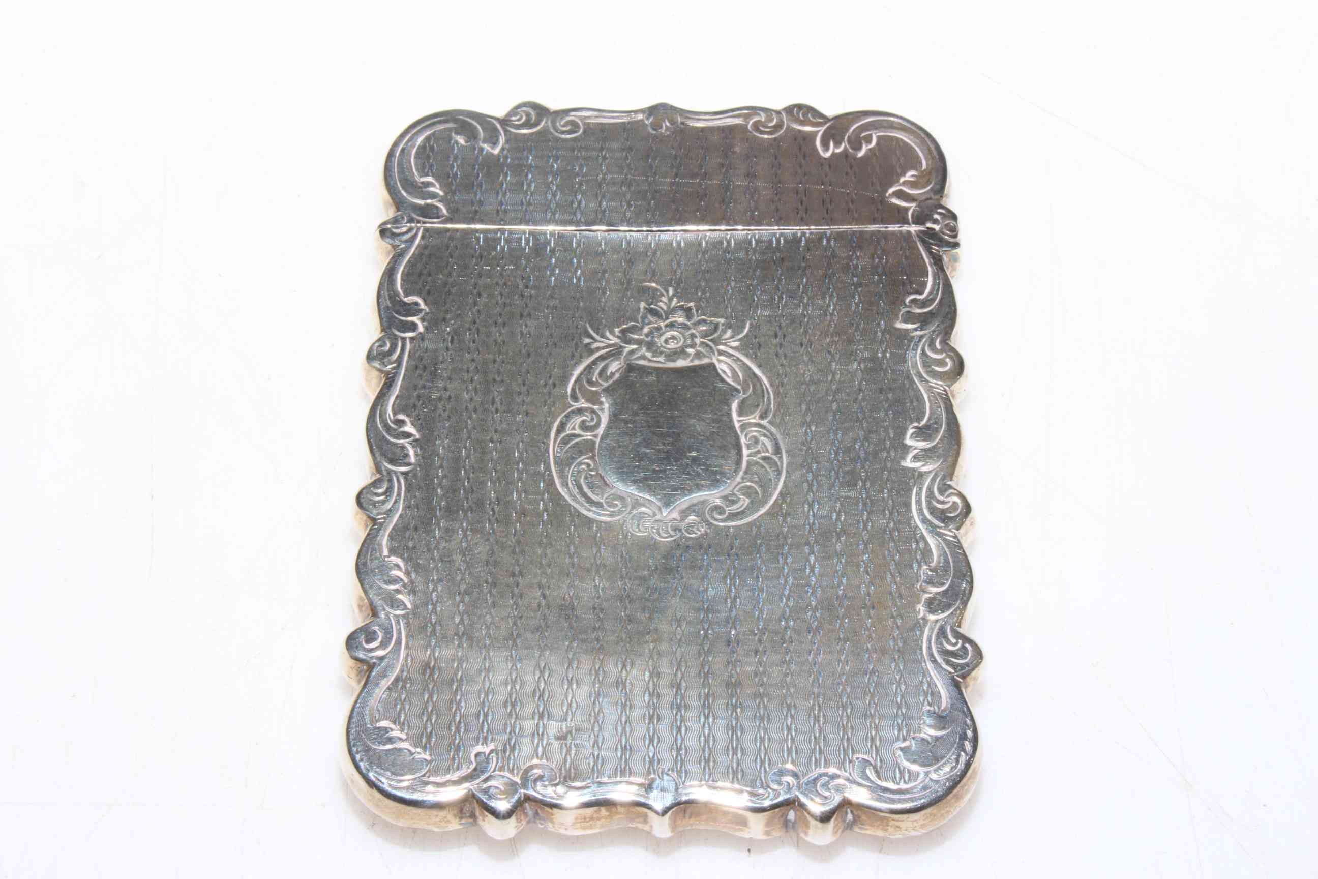 Victorian silver card case, engine-turned with scroll border and vacant cartouche, 9.