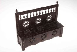 19th Century heavily carved oak candle box in the form of a settle, 33cm by 27cm by 10cm.