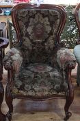 Victorian mahogany framed gents chair in floral pattern fabric.