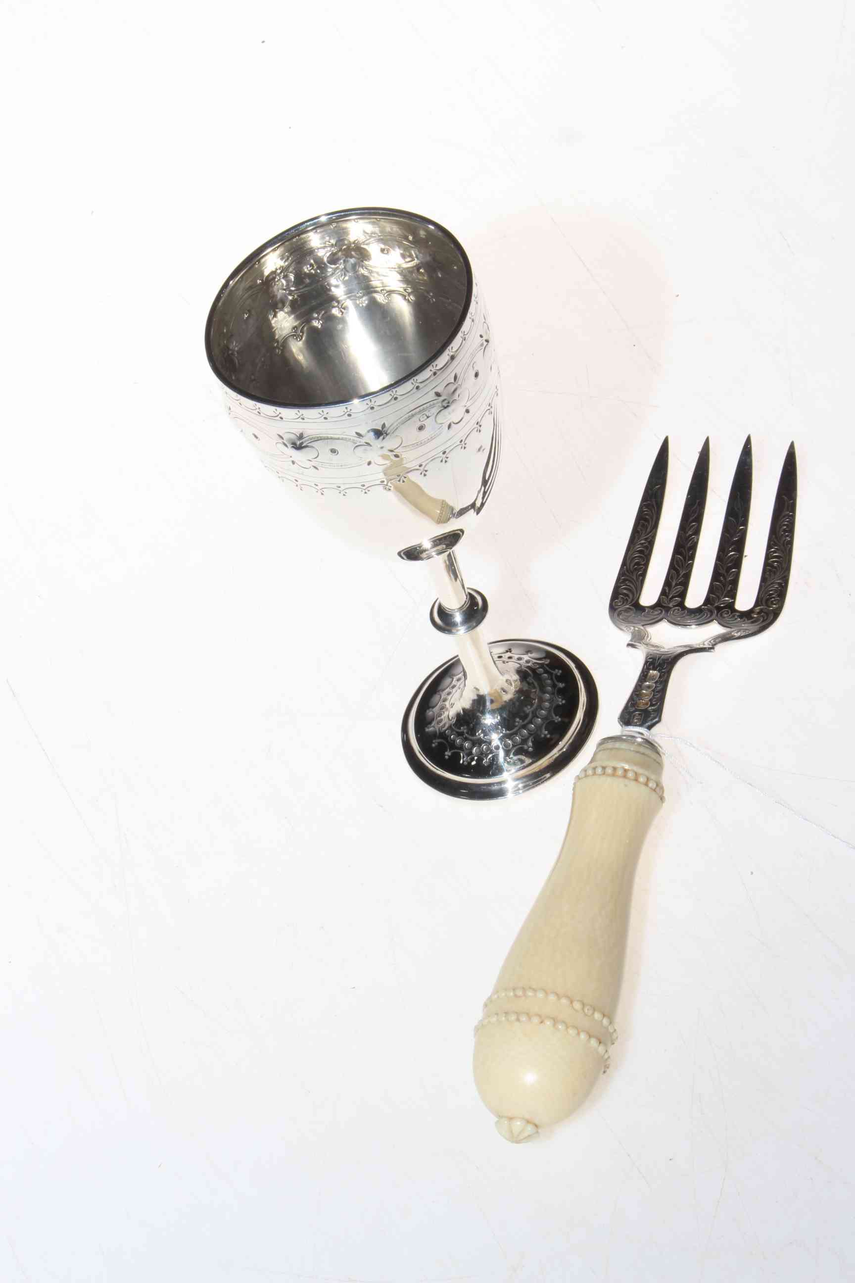 Victorian silver and ivory serving fork, Birmingham 1849, and silver goblet, Birmingham 1874 (2).