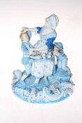 Continental porcelain group of lady with basket of grapes and two mischievous boys, 25cm high,