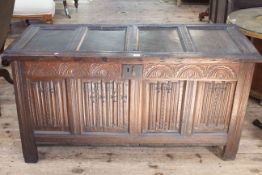 Antique oak carved panel front coffer, 67cm high by 131cm wide by 56cm deep.