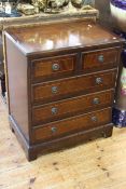 Mahogany and line inlaid chest of two short above three long drawers on bracket feet,