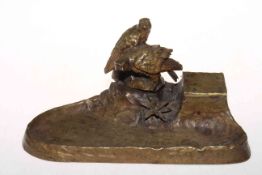 Late 19th Century cast bronze inkstand with eagles on naturalistic base, 28cm across.