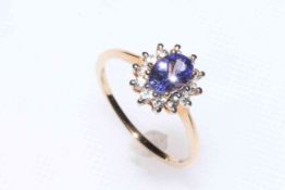 Tanzanite and zircon 9 carat gold cluster ring, size P/Q, with certificate.