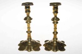 Pair almost matching antique brass petal candlesticks, 20cm.