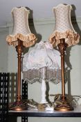 Pair of and one single table lamps with shades, 57cm and 78cm.
