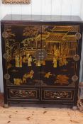 Oriental style black lacquered cabinet having two doors above two drawers,