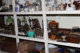 Large shelf collection of metalwares including tea caddy, writing slope, cased cutlery, oil lamp,