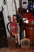 Collection of rackets, walking canes and umbrellas including Whipshaft and Slazenger rackets,