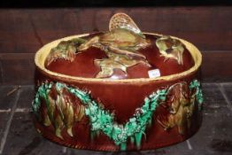 Majolica game dish and cover, having relief decoration, 32cm wide, 19.5cm high.