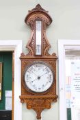 Victorian carved oak aneroid barometer-thermometer.