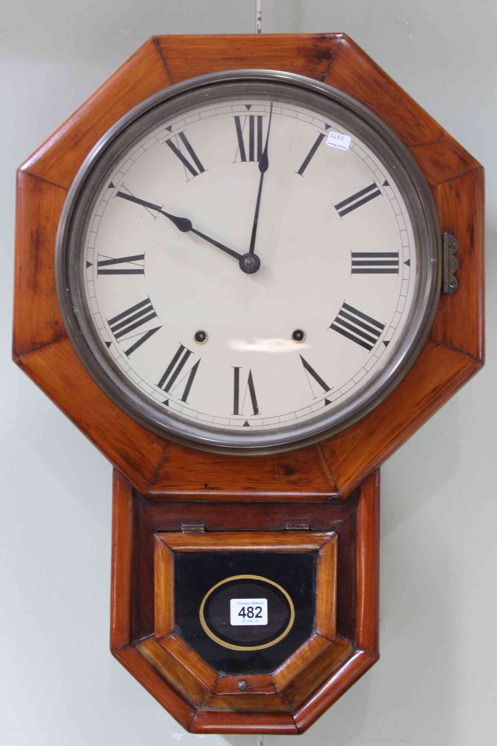 Stained wood wall clock.