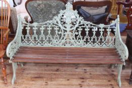 Coalbrookedale style garden bench with armorial shield back, 100cm high by 150cm long.