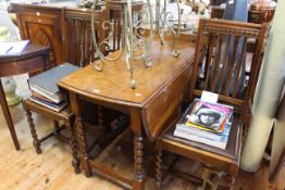 Oak barley twist gate leg dining table and four chairs.