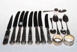 Two silver napkin rings, silver spoons, silver handled knives, letter knife and pepperette.