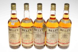 Five bottles Bell's Extra Special whisky.