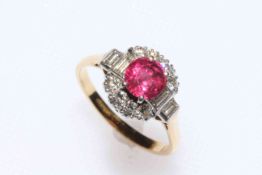 Ruby and diamond cluster ring set in 18 carat gold and platinum,