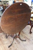 19th Century circular oak snap top supper table on pedestal tripod base, 88cm diameter.