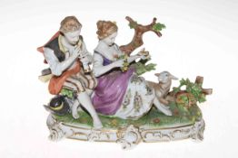 Unterweissbach porcelain pastoral group of pipe playing shepherd and maiden, 25cm across, 18cm high,