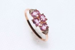 Four stone pink Padparadscha sapphire and 9k gold ring, size Q, with certificate.