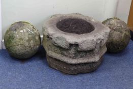 Weathered octagonal shaped stone garden trough, 34cm by 54cm diameter and pair weathered stone orbs.