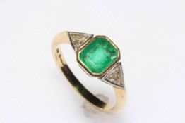 Emerald and diamond ring set in 18 carat yellow gold,