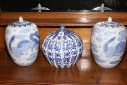 Three modern Oriental jars with lids, 31cm and 25cm high.