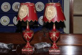 Pair of as new red country view table lamps and shades, 55cm high.