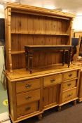 Victorian waxed pine dresser base and later shelf back 202cm high by 151cm wide by 48cm deep.