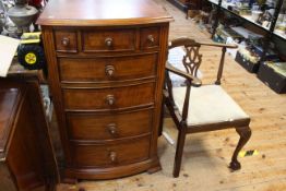 Seven drawer bow front chest and late Victorian Chippendale style corner elbow chair.