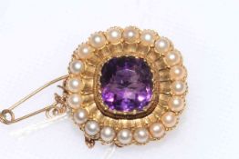 Victorian gold amethyst and seed pearl brooch with safety chain, 20mm across.