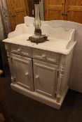 White washed open two drawer bookcase with tongue and groove panel back,