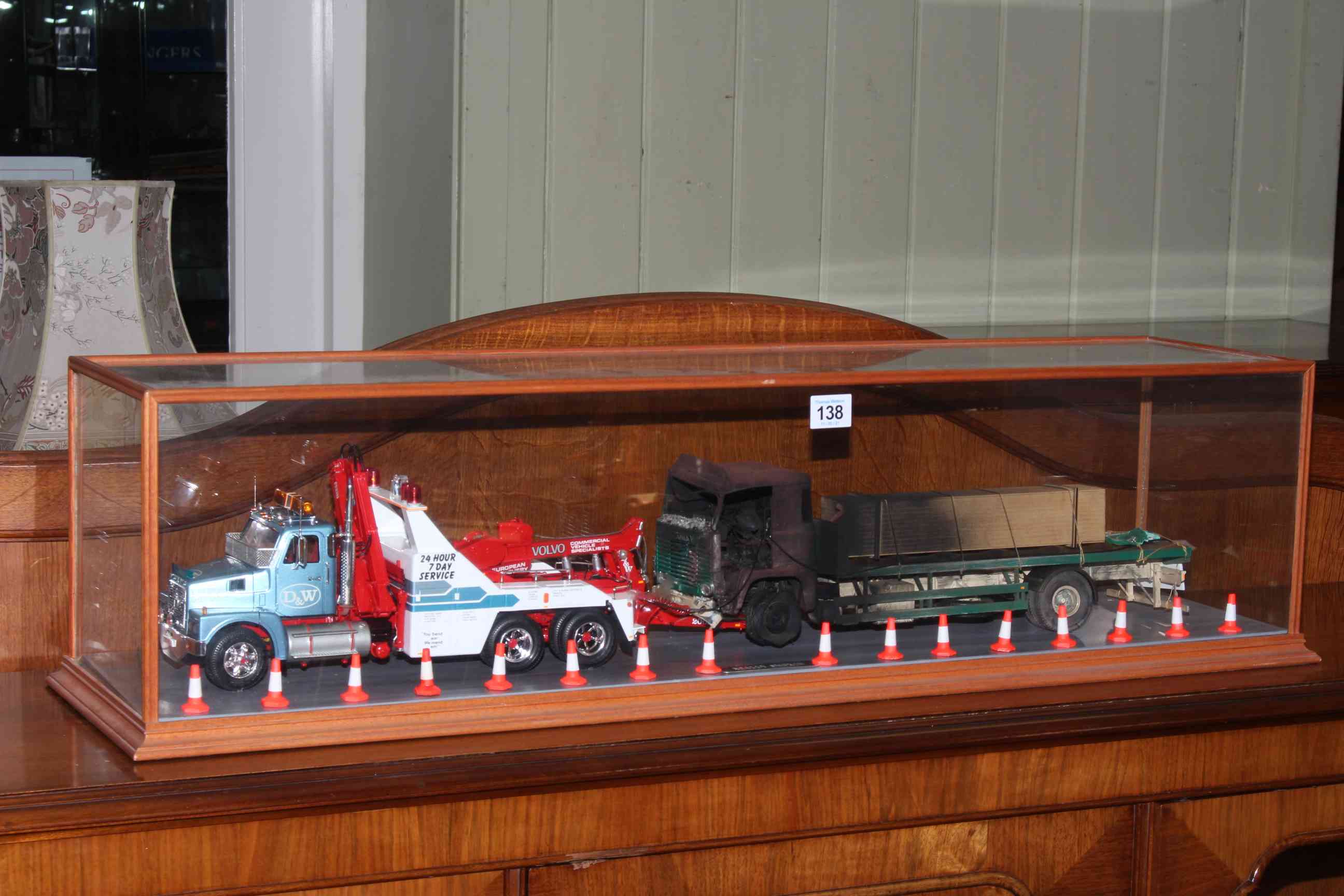 D & W Yeovil Recovery Truck and part burned out truck with bollards, in glazed case.