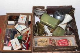 Collection of lighters and vintage match boxes.