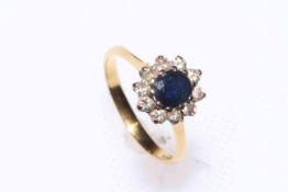 18 carat gold, sapphire and diamond eleven stone cluster ring, size J/K.